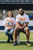 two staff members in short sleeve white tee